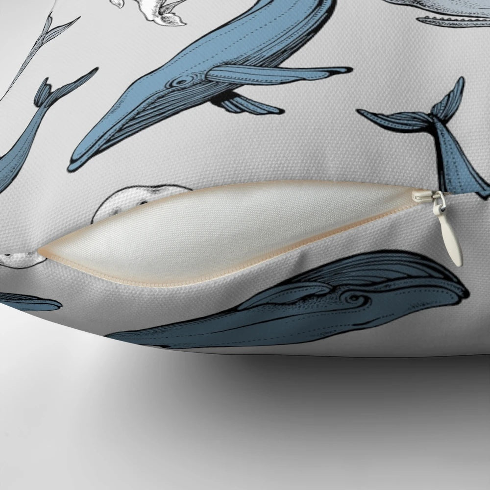 Decorative throw pillow with a seamless pattern of whales and other marine mammals.