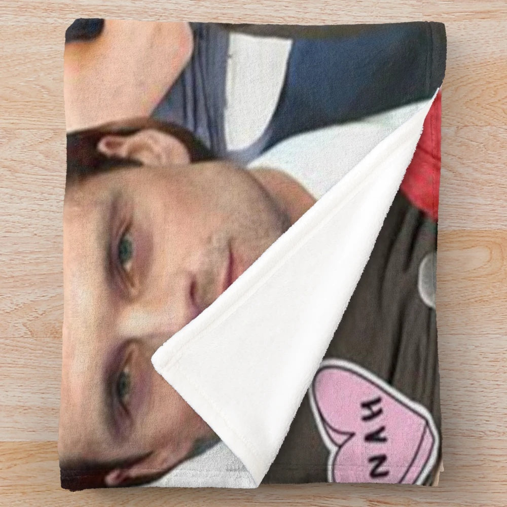 A collage-style plush blanket featuring images of actor Sebastian Stan as the Marvel character Bucky Barnes