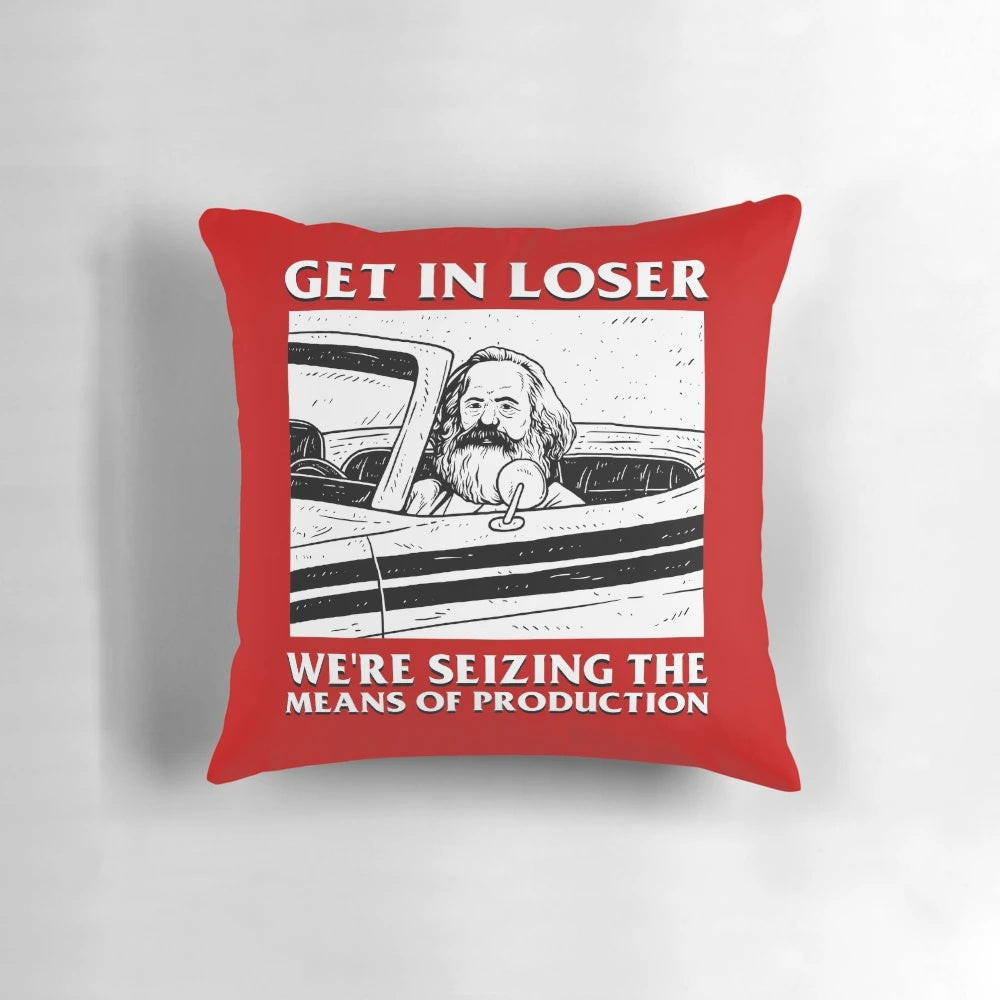 Plush communist-themed pillow with "Get In Loser We're Seizing The Means Of Production" text