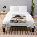 Sepia-toned plush blanket with a realistic drawing of Sam Elliott, the iconic Western actor, in his signature cowboy attire.