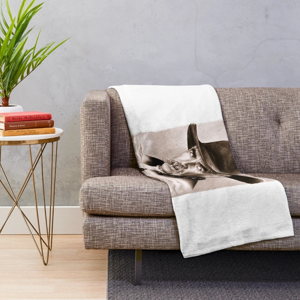 Sepia-toned plush blanket with a realistic drawing of Sam Elliott, the iconic Western actor, in his signature cowboy attire.