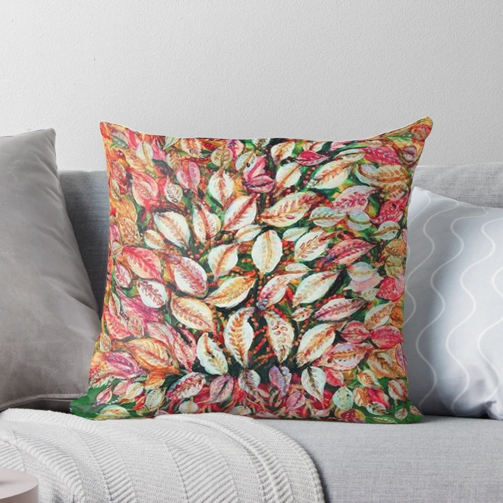 Vibrant pillow featuring the botanical artwork of French painter Seraphine Louis, showcasing colorful plant leaves and foliage.