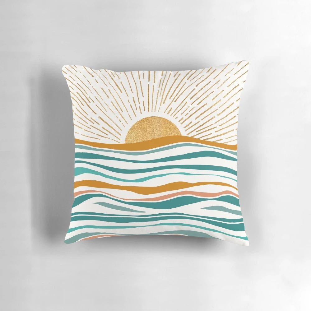Abstract landscape pillow design featuring a blue sky, ocean waves, and golden sunshine