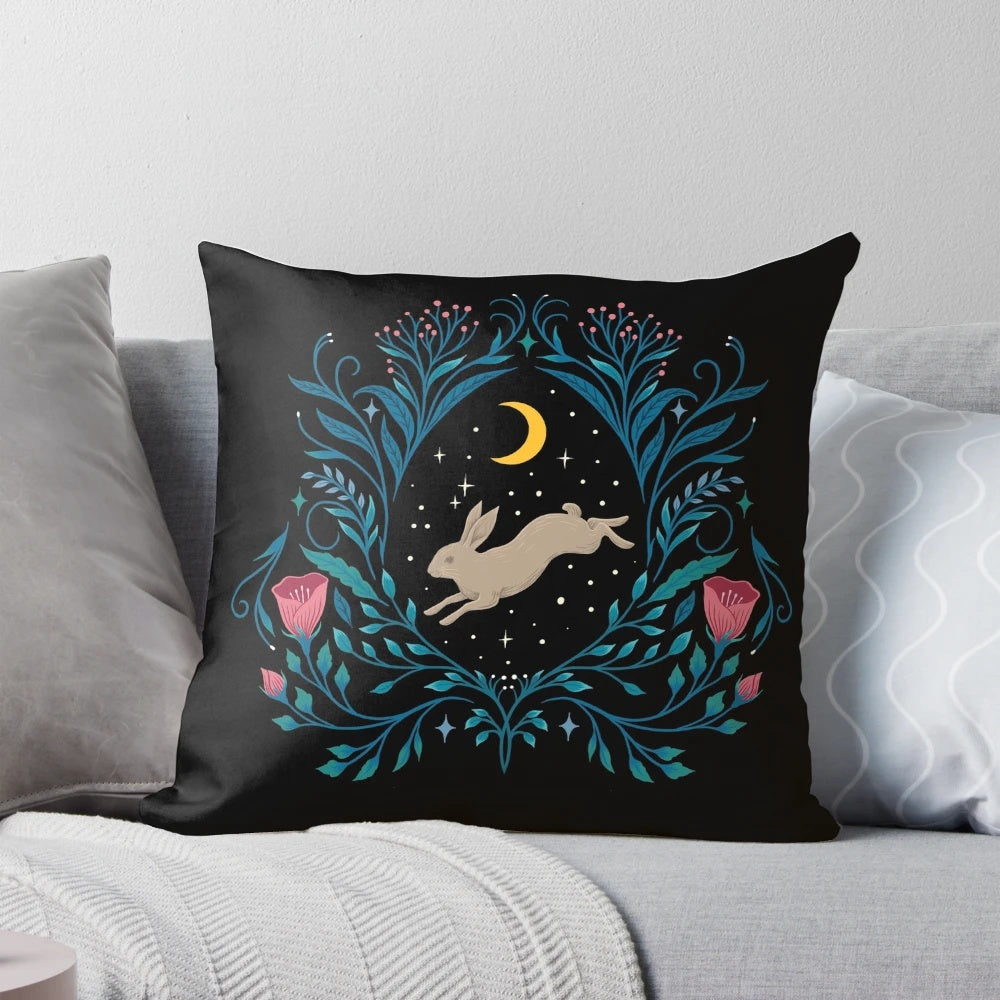 A beautiful black and white botanical throw pillow featuring a full moon and nighttime garden scene.