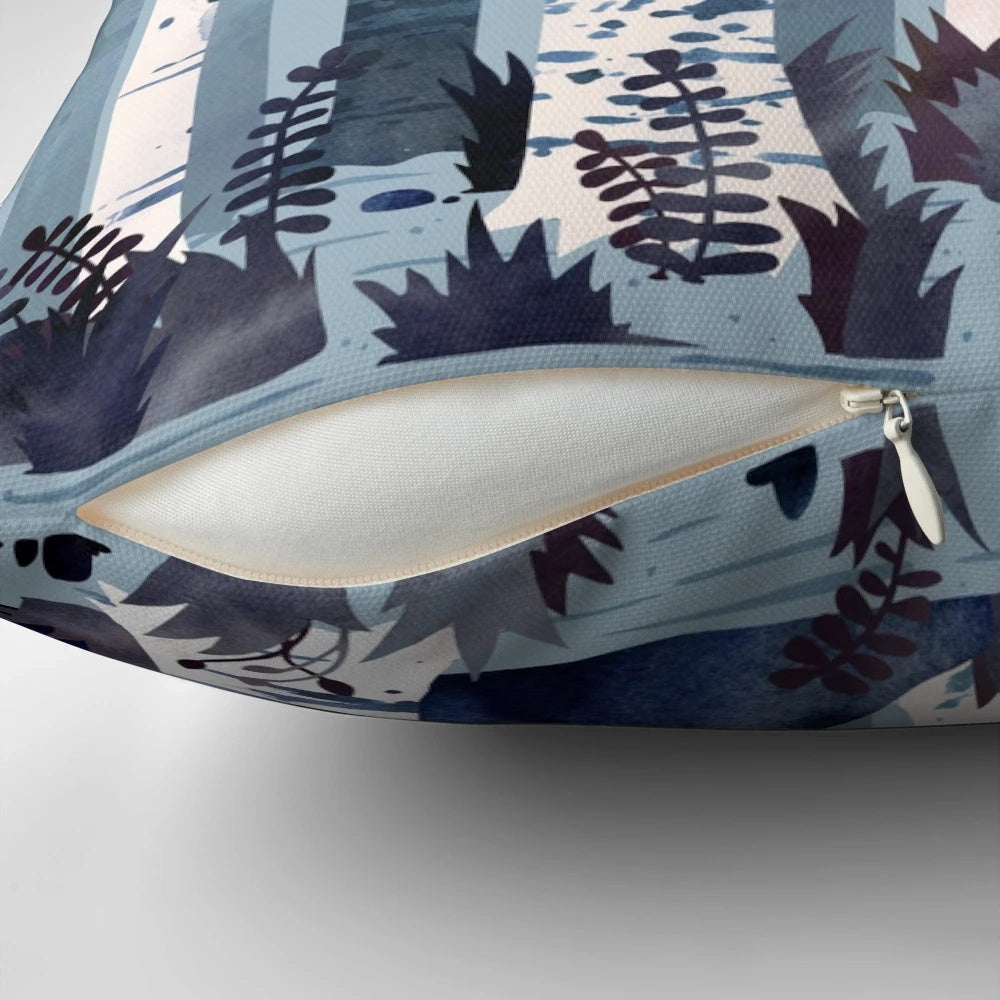 Blue and white watercolor painting of birch trees in a forest, featured on a decorative throw pillow.