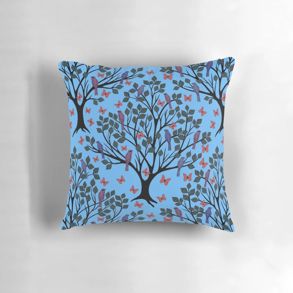 A beautiful blue pillow featuring a vibrant butterfly migration scene, perfect for adding a touch of nature to any space.