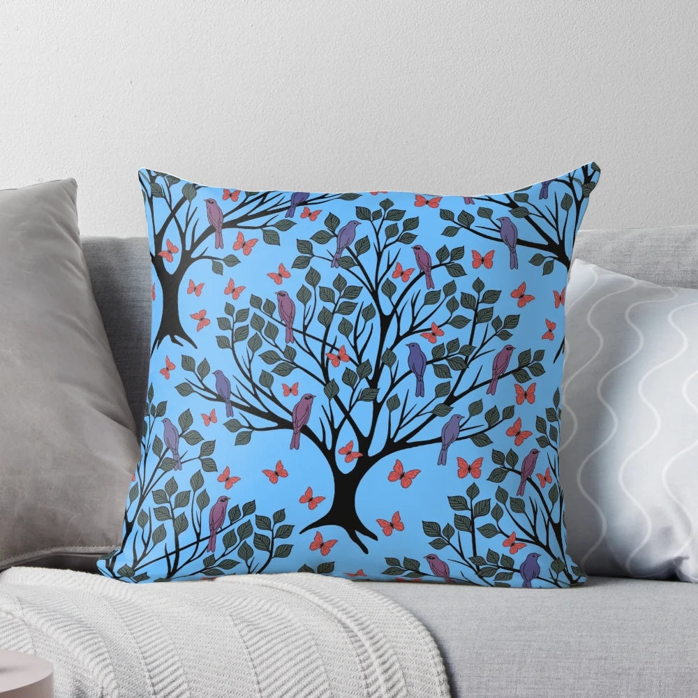 A beautiful blue pillow featuring a vibrant butterfly migration scene, perfect for adding a touch of nature to any space.