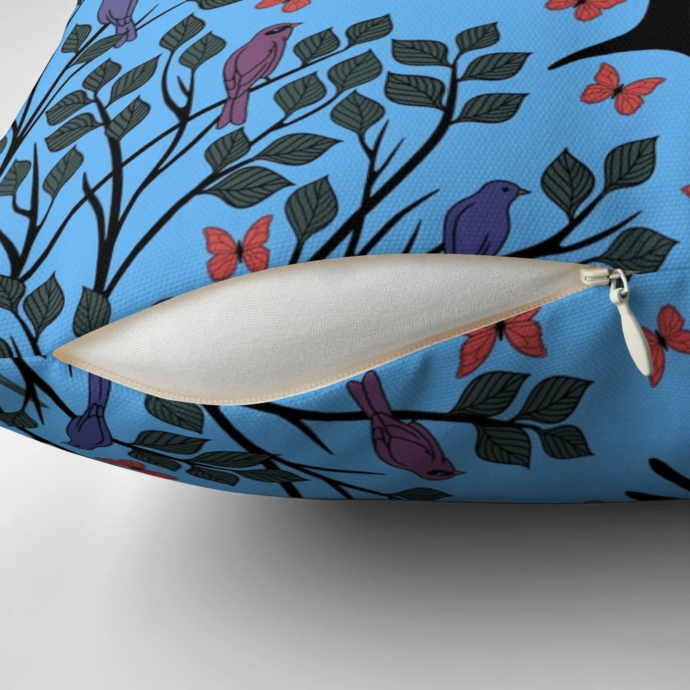 A beautiful blue pillow featuring a vibrant butterfly migration scene, perfect for adding a touch of nature to any space.