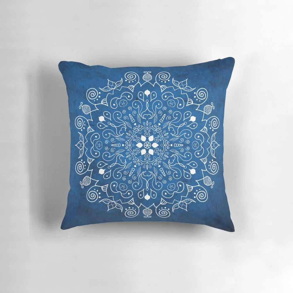Vibrant blue mandala design on a soft, plush pillow for peaceful home decor and yoga practice.