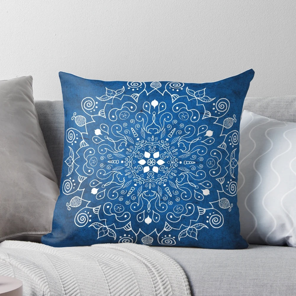 Vibrant blue mandala design on a soft, plush pillow for peaceful home decor and yoga practice.