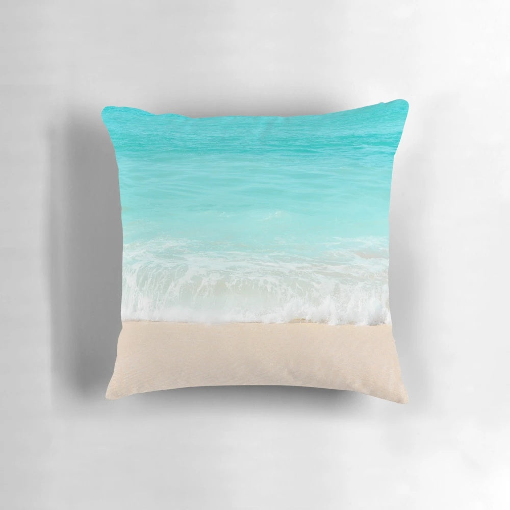 Calming blue ocean shore pillow with waves and beach scenery
