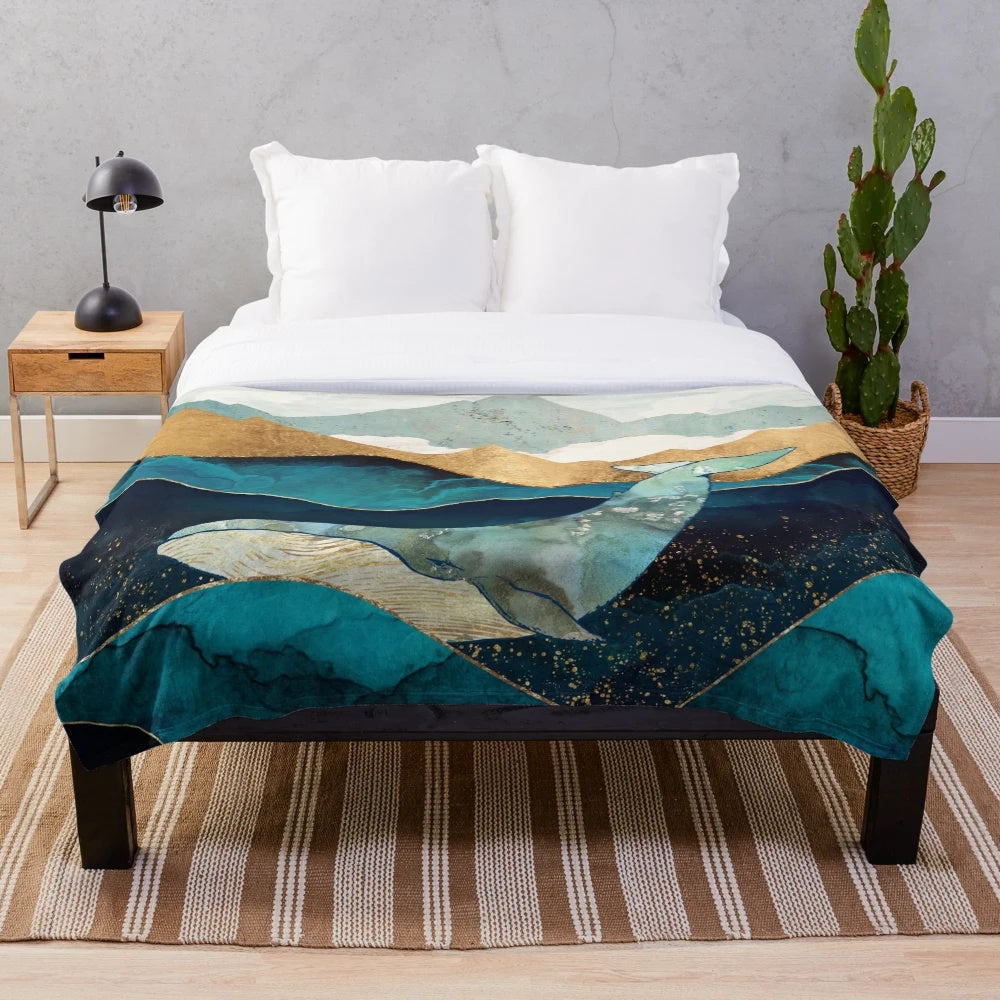 Blue whale plush blanket with watercolor and abstract ocean design