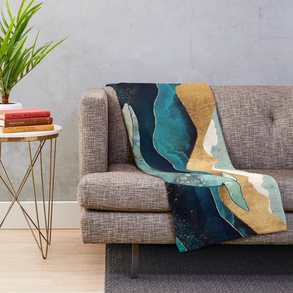 Blue whale plush blanket with watercolor and abstract ocean design