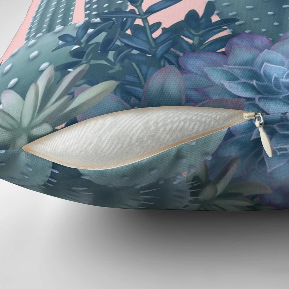 Decorative pillow featuring a soothing design of cacti against a rose quartz background.