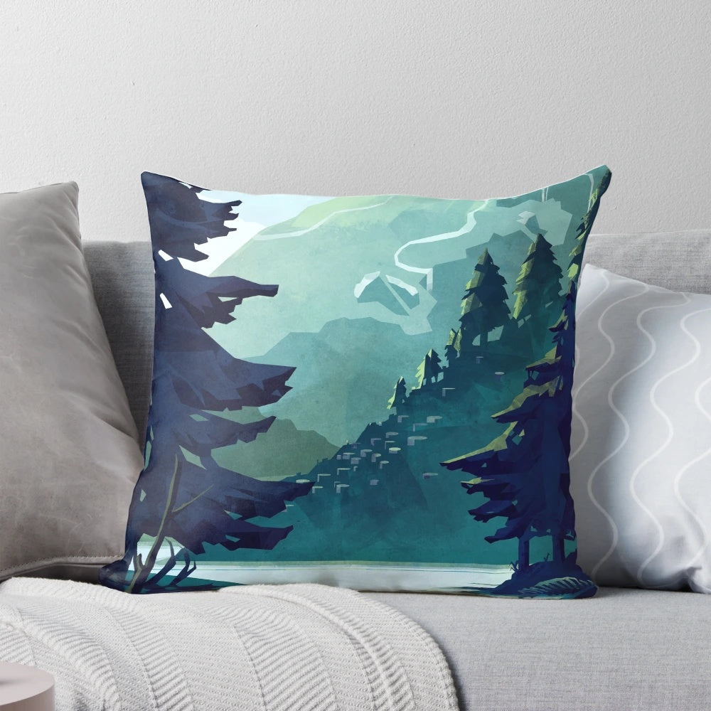 A cozy pillow featuring a beautiful landscape of the Canadian mountains, with a blue sky, green forests, and a tranquil lake or river.