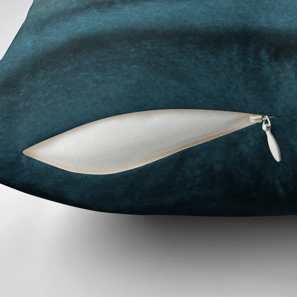 Decorative throw pillow featuring a watercolor abstract design of crashing ocean waves in shades of blue and green.