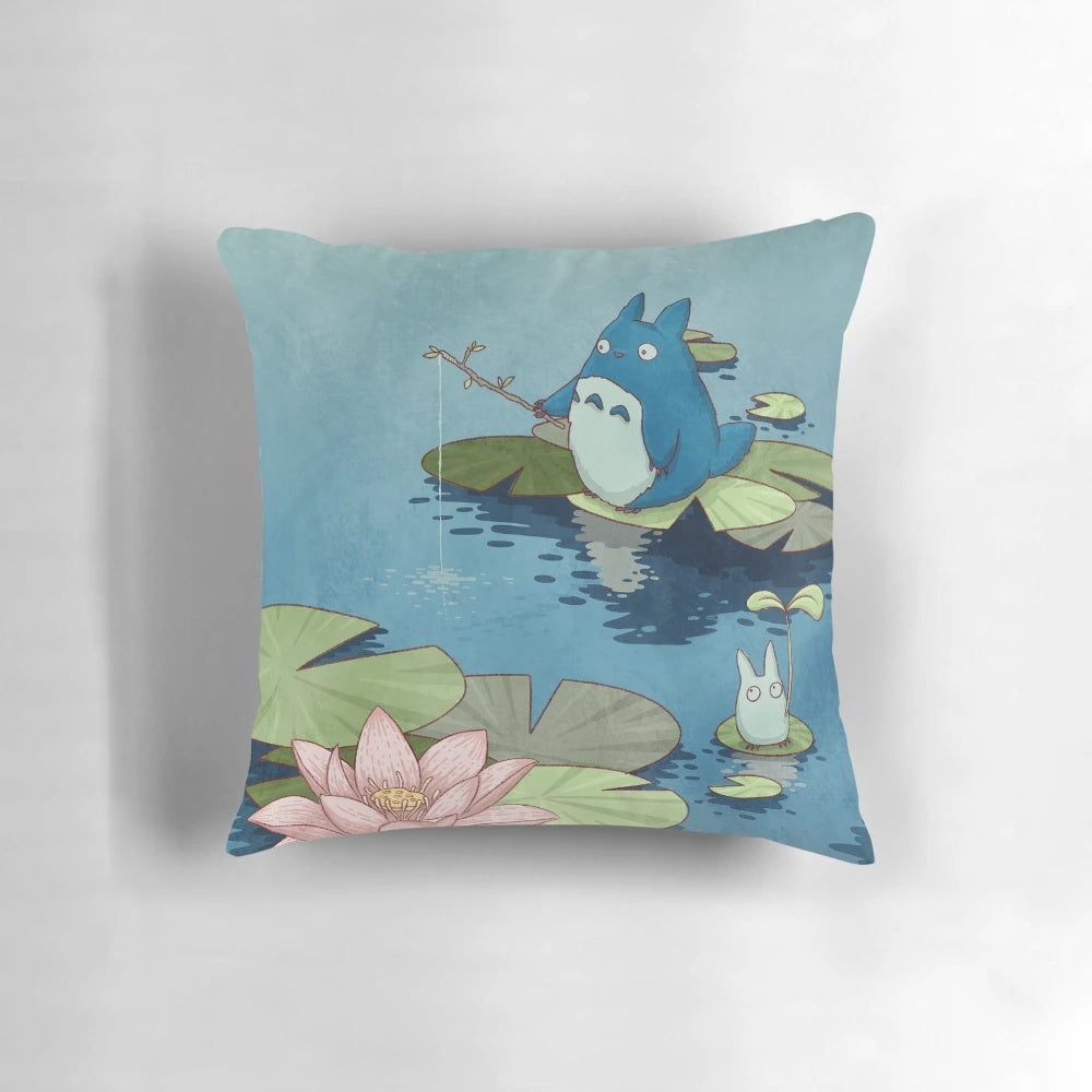 Decorative throw pillow featuring a tranquil fishing pond scene with lotus flowers, koi fish, and anime-style chibi characters.