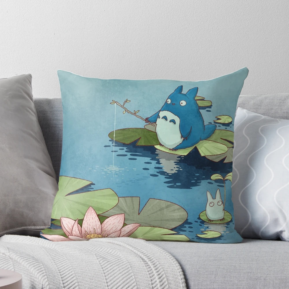 Decorative throw pillow featuring a tranquil fishing pond scene with lotus flowers, koi fish, and anime-style chibi characters.