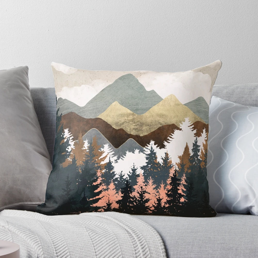 Decorative forest-themed pillow with a scenic landscape design