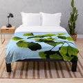 Ginkgo biloba tree leaves printed on a soft, plush blanket