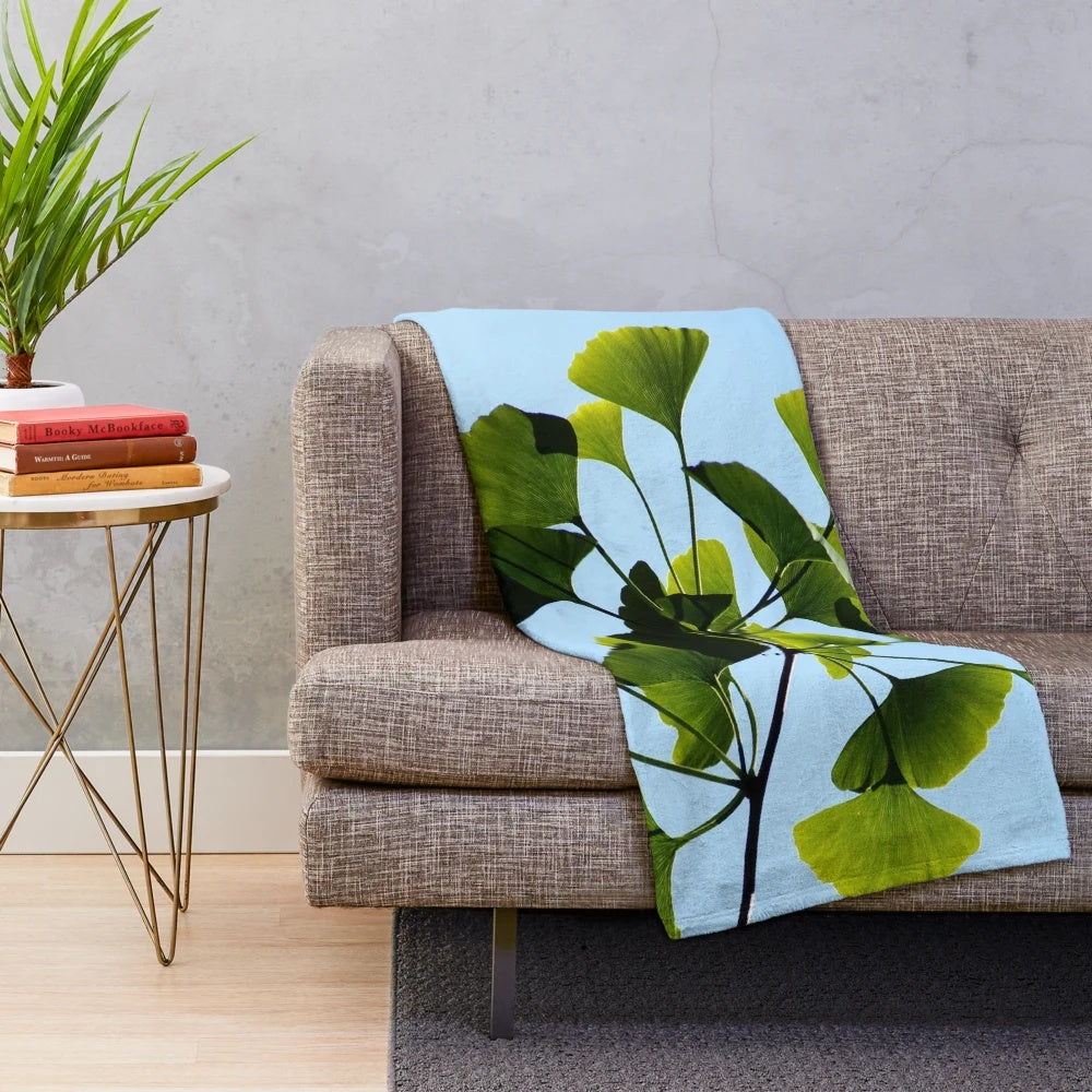 Ginkgo biloba tree leaves printed on a soft, plush blanket