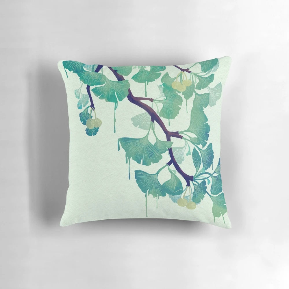Green pillow with a ginkgo leaf design, showcasing a surreal, melting effect