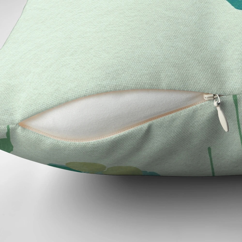 Green pillow with a ginkgo leaf design, showcasing a surreal, melting effect