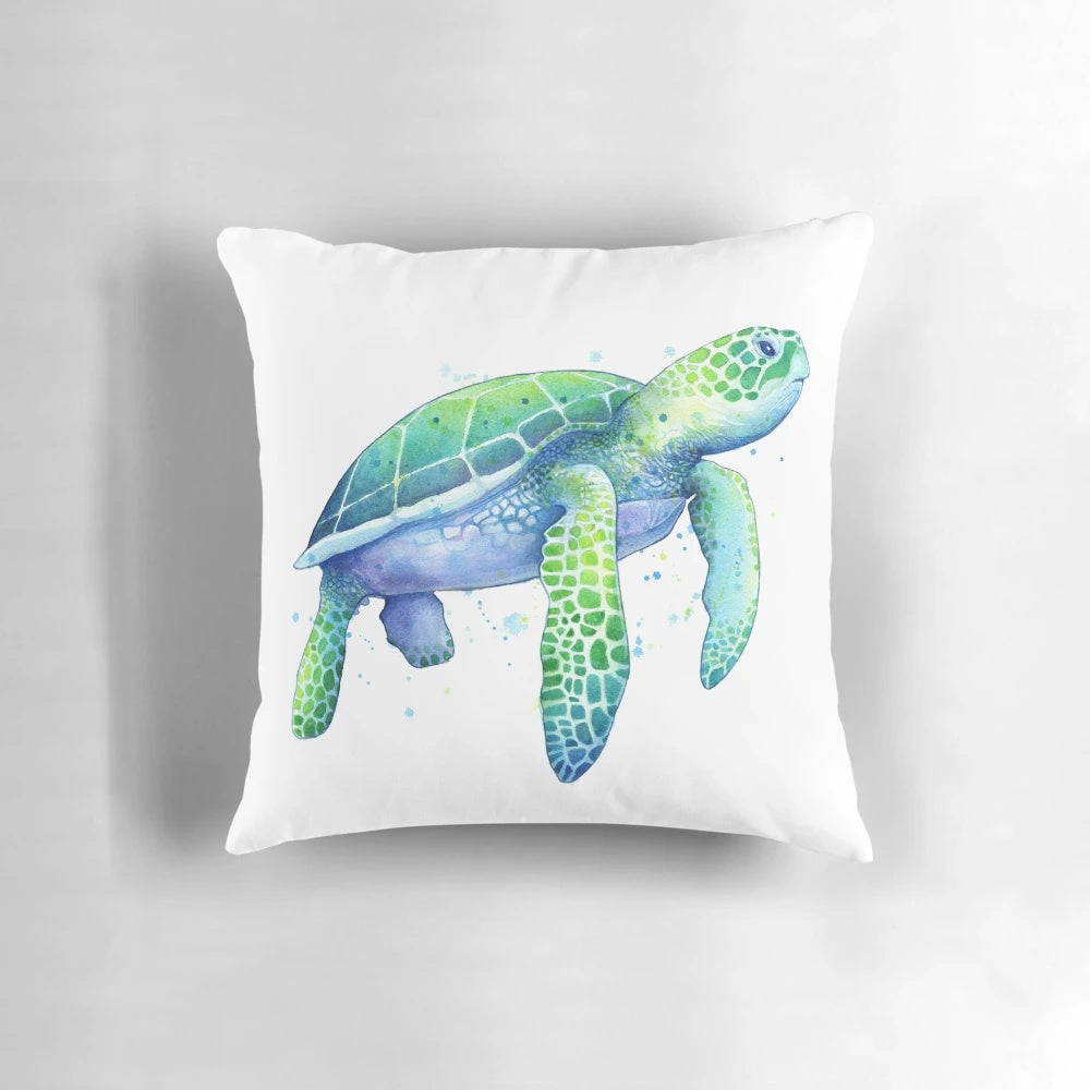Soft, plush pillow featuring a watercolor painting of a green sea turtle swimming in the ocean