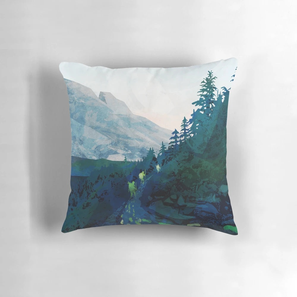 Jade-colored landscape pillow featuring a scenic mountain and sunset design, inspired by the natural heritage of Canada.