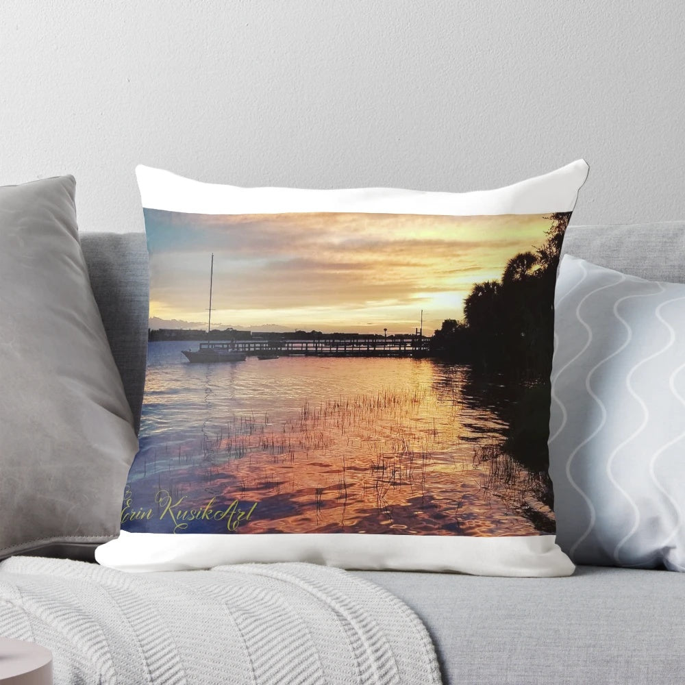 Calm Before the Storm Pillow featuring a peaceful beach scene with a sailboat at sunset