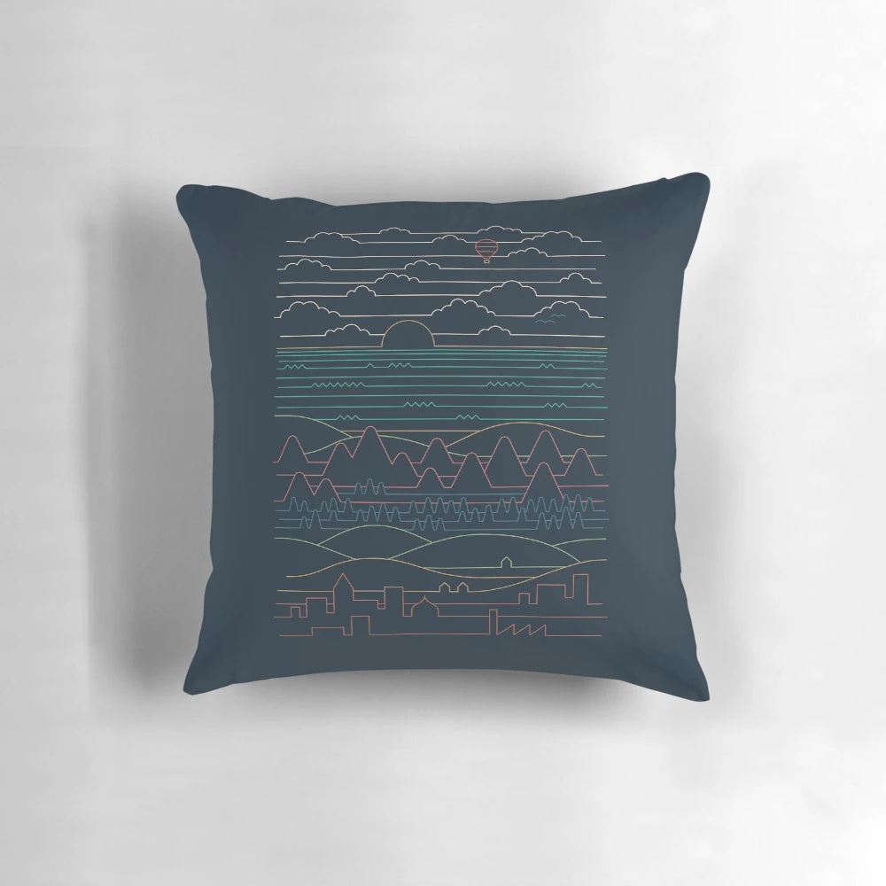 A stylish linear landscape pillow featuring a minimalist design with mountains, clouds, and a sea or ocean scene.