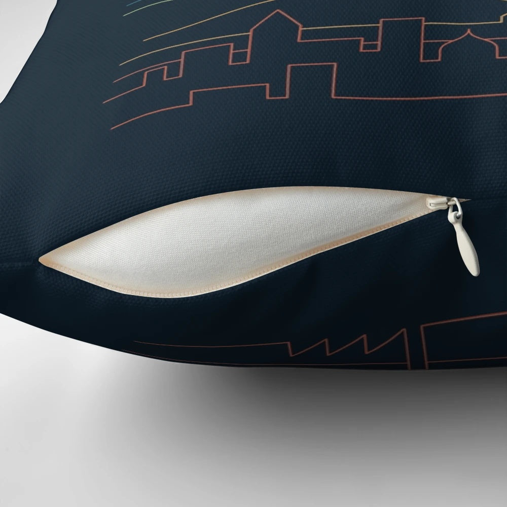 A stylish linear landscape pillow featuring a minimalist design with mountains, clouds, and a sea or ocean scene.