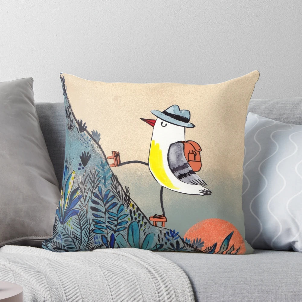 Pillow featuring a detailed illustration of a bird hiking in the mountains at sunrise
