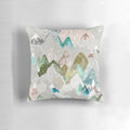 A watercolor-style pillow featuring a misty mountain range, perfect for nature-inspired home decor.