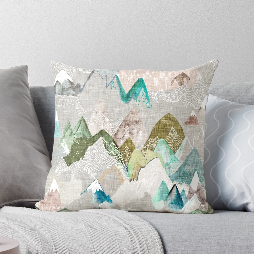 A watercolor-style pillow featuring a misty mountain range, perfect for nature-inspired home decor.