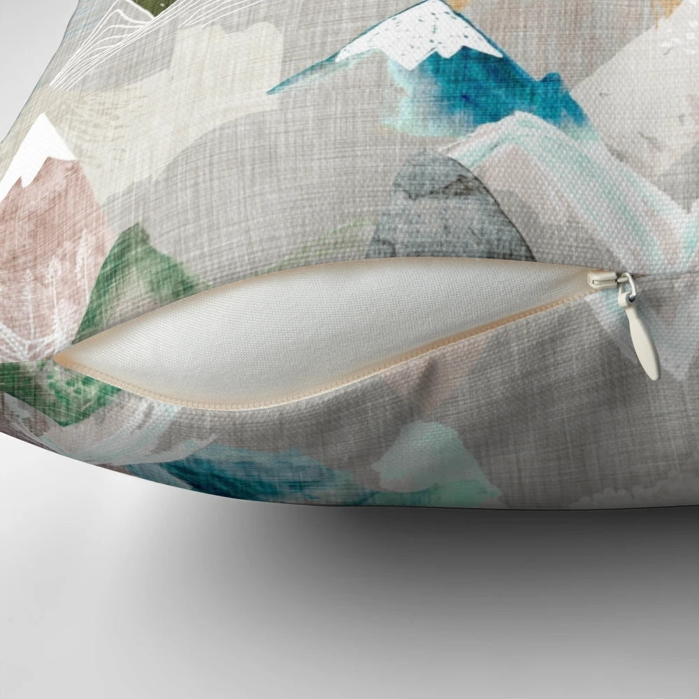 A watercolor-style pillow featuring a misty mountain range, perfect for nature-inspired home decor.