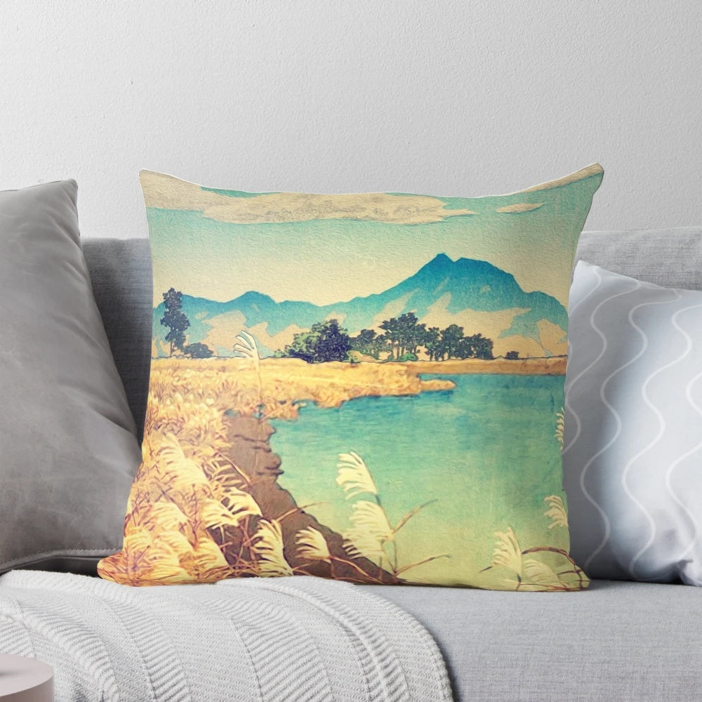 Vibrant nature landscape pillow featuring a mountain sunset scene with blue skies, clouds, and trees