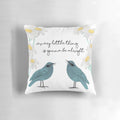 Decorative throw pillow featuring a collage-style design of birds, daisies, and nature-inspired elements in teal, blue, and green colors.