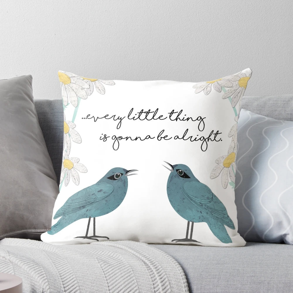 Decorative throw pillow featuring a collage-style design of birds, daisies, and nature-inspired elements in teal, blue, and green colors.