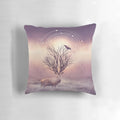 A pillow featuring a peaceful winter landscape with deer, birds, and tree branches against a backdrop of frost and stillness.