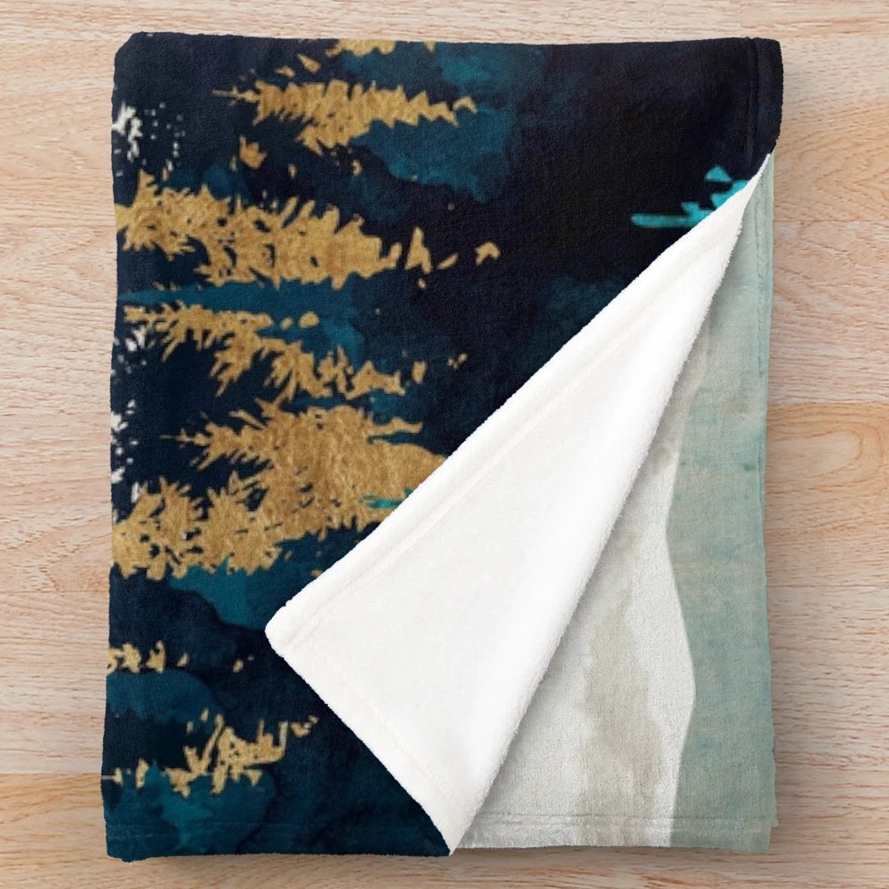 Plush blanket with abstract, nature-inspired design in shades of blue, green, and gold