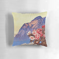 A cozy decorative pillow with a stunning nature landscape design featuring mountains, clouds, and colorful flowers.