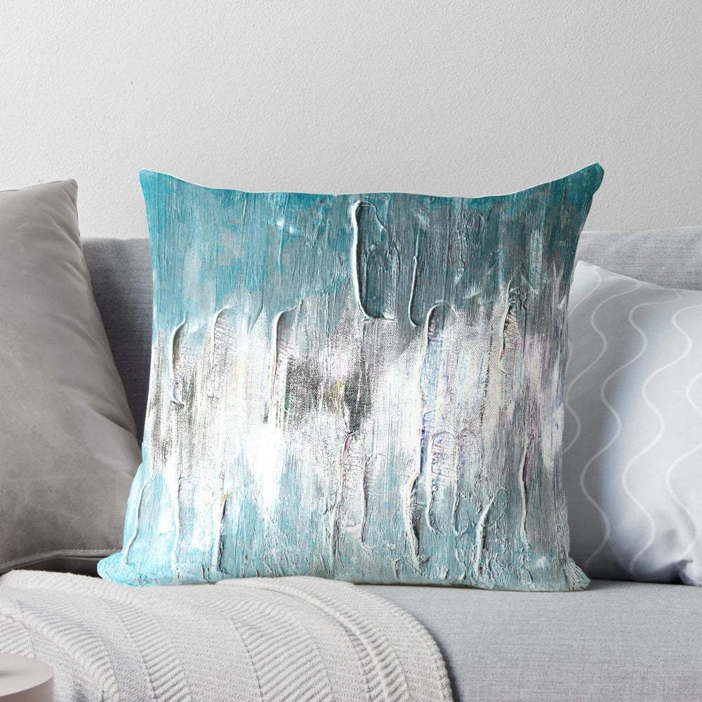 Teal and blue abstract waves design on a soft, modern throw pillow for coastal or minimalist home decor.