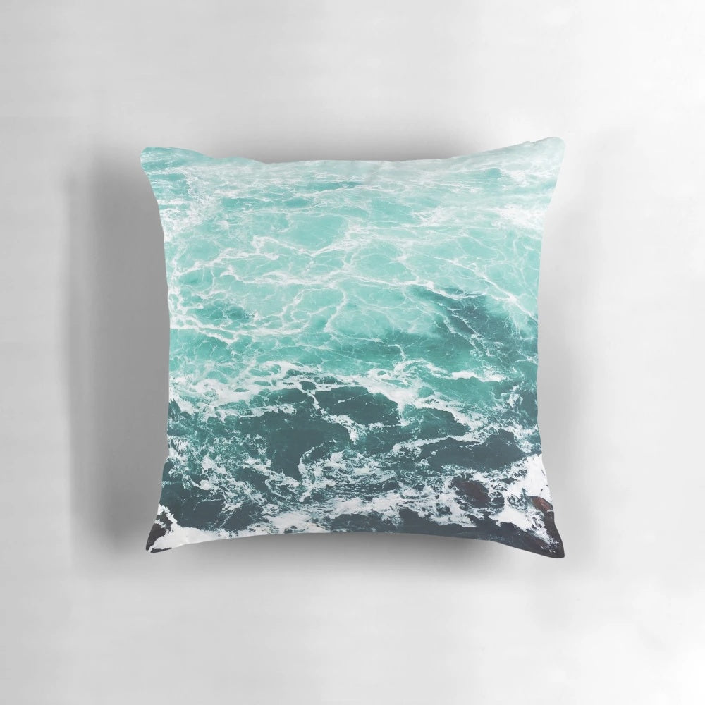 Soft, vibrant beach-themed pillow with ocean waves design
