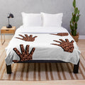 Plush blanket with a blend of textures and soothing sounds