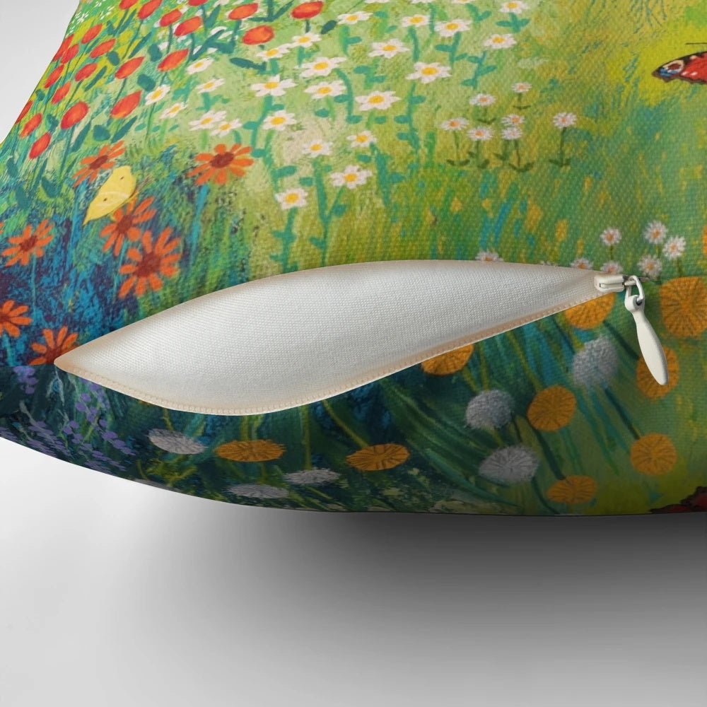 Decorative pillow featuring a painting of a garden by the sea with butterflies and birds