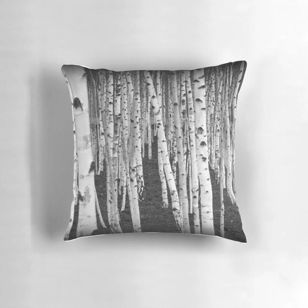 Close-up of the intricate, textured bark of a silver birch tree in a nature-inspired monochrome design.
