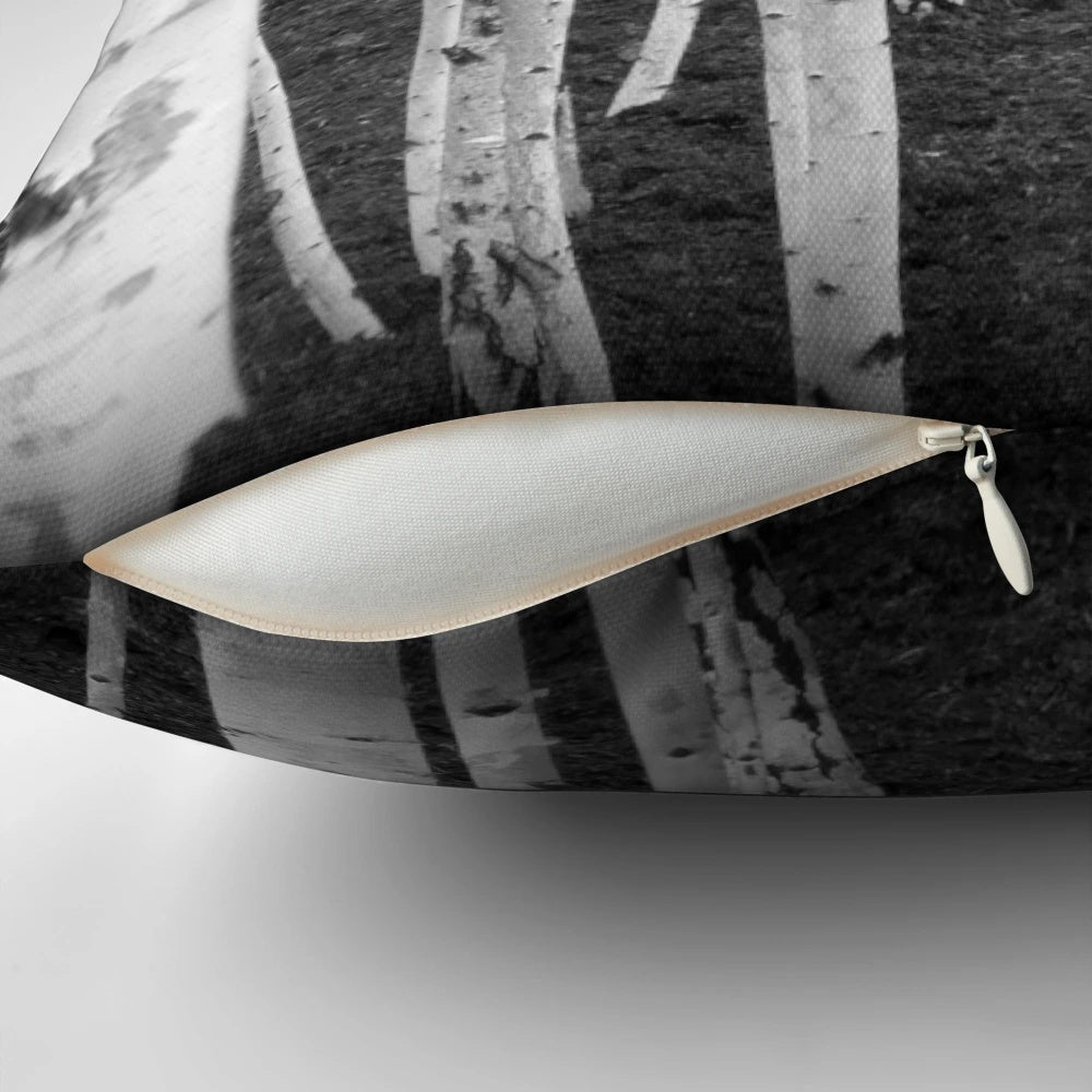 Close-up of the intricate, textured bark of a silver birch tree in a nature-inspired monochrome design.