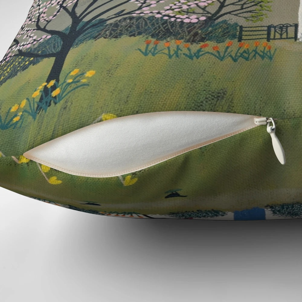 A pillow featuring a beautiful spring landscape with blooming daffodils and picturesque cottages in the countryside.