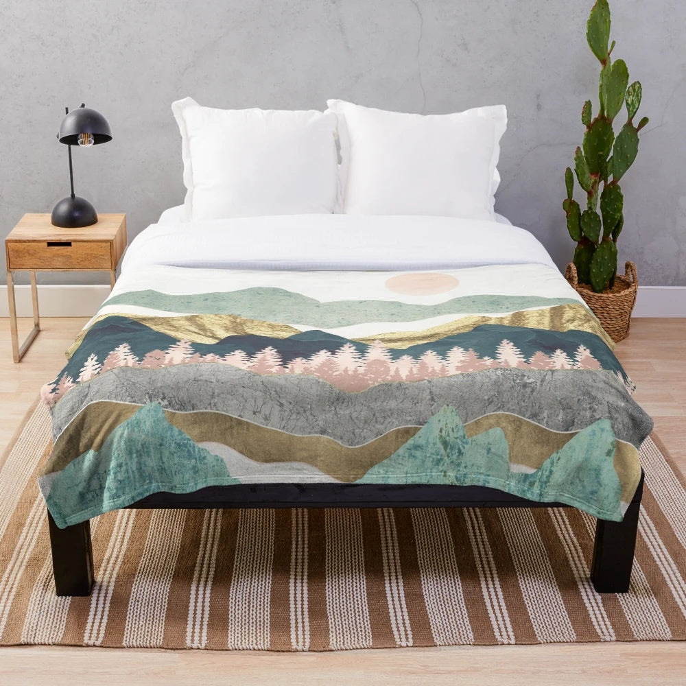 Soft, cozy plush blanket with a nature-inspired vista design